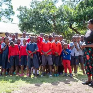 a group of children standing in a line