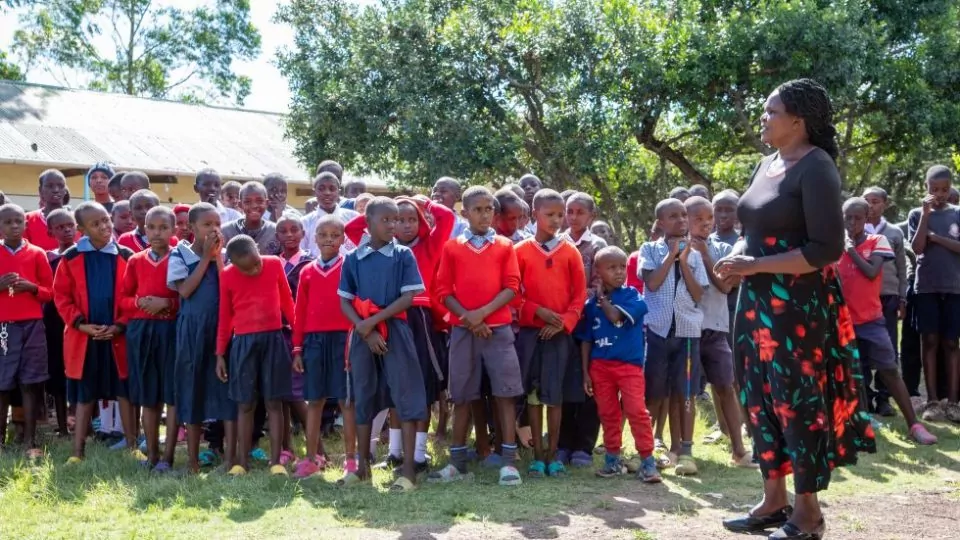 a group of children standing in a line