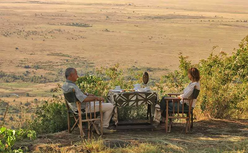 Bush Meals - couple sitting in front of Masai Mara view